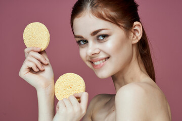 woman with bare shoulders sponge in hands clean skin hygiene