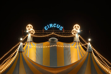 A circus tent at night with its colorful lights on  © RMMPPhotography