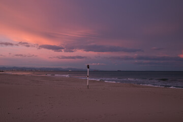 Path of a beach at sunset in winter