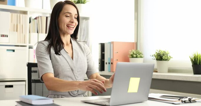 Business woman typing on laptop keyboard and rejoicing 4k movie slow motion