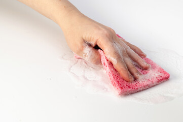 hand holds a soapy washcloth, on a white background, concept, home cleaning, business, home hygiene, cleanliness