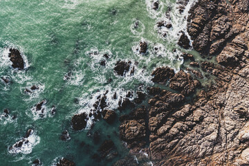 Obraz premium Sea landscape, drone view ocean coast, rocks and ocean in vintage tones..