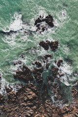 Fototapeta premium Sea landscape, drone view ocean coast, rocks and ocean in vintage tones..