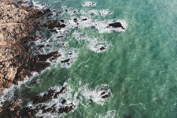 Sea landscape, drone view ocean coast, rocks and ocean in vintage tones..