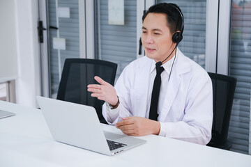 doctor working call center operator with headset in hospital or workplace