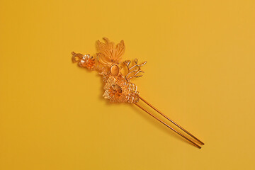 Chinese hairpin hair clips on a yellow background. Chinese traditional jewelry. flat lay