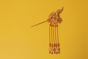 Chinese hairpin hair clips on a yellow background. Chinese traditional jewelry. flat lay