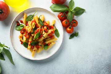 Traditional Italian pasta with tomatoes and basil