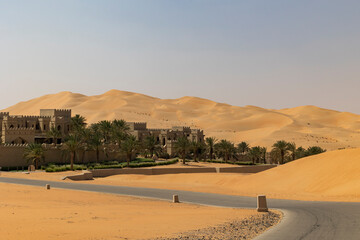 Road in the Empty Quarter (Rub' al Khali) desert area of Abu Dhabi, United Arab Emirates