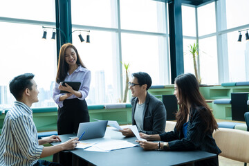 Group of creative business people discussion ideas next project in modern office.