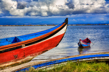Fototapeta na wymiar Typical Boats, Called Moliceiros, in the Fishing Village of Torreira, near Aveiro, Portugal