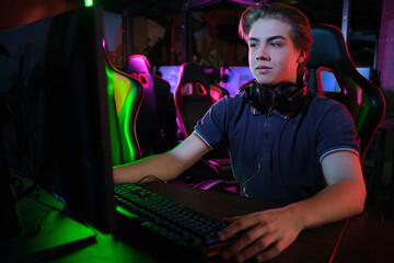 Cyber sport. Team play. Professional cybersport player training or playing online game on his PC