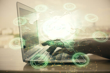 Double exposure of woman hands typing on computer and social network theme hologram drawing. People media concept.