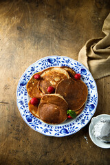 Traditional homemade pancakes with raspberry