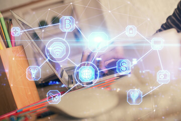Double exposure of woman hands typing on computer and social network theme hologram drawing. People media concept.