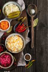 Pickled vegetables on wooden background. Salting vegetables.