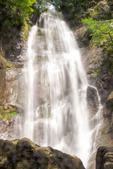 Obraz premium Makhuntseti waterfall, one of the highest waterfalls in Ajara. Point in a Acharistsqali river, where water flows over a vertical drop or a series of steep drops