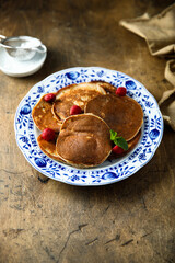 Traditional homemade pancakes with raspberry