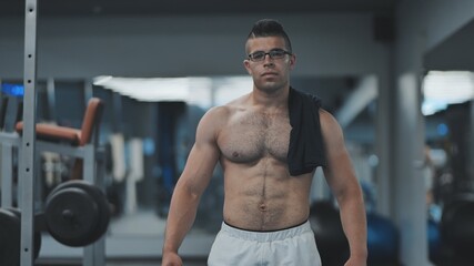 Fototapeta na wymiar Muscular Arab in the gym after a workout.
