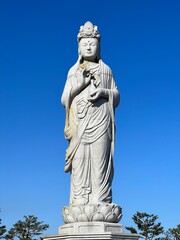 Fototapeta na wymiar 해수관음상, 양양 낙산사. Guan Yin statue at Naksansa Temple in Yangyang, Korea