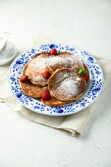 Traditional homemade pancakes with raspberry