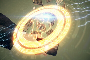 Multi exposure of blockchain theme drawing hologram and USA dollars bills and man hands. Business concept.