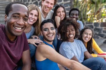 Young multiracial group of friends taking selfie sitting on urban stairs - Youth millennial...