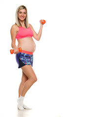 Pregnant smiling woman lifting weights