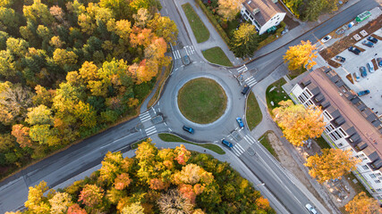 Aerial view of traffic in a roundabout next to a city in Germany - obrazy, fototapety, plakaty