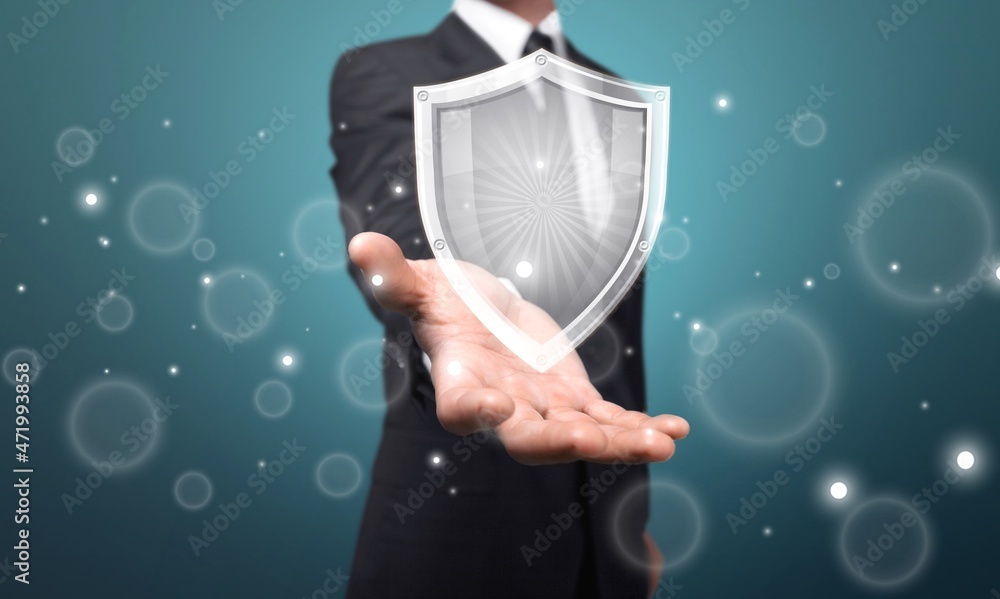 Poster Businessman holding shield protect icon for internet or computer virus cleaner.