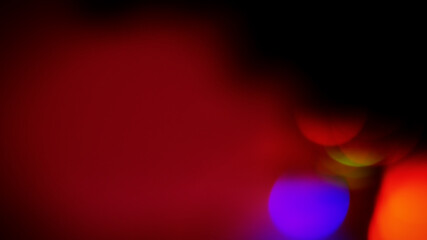 Abstract blurred background, orange and blue spots of night illu