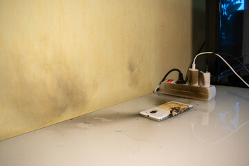 Dirty walls from soot and consequences of the bang of mobile phone battery