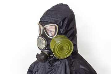 Person wearing gas mask and jacket with hood in profile