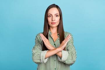 Photo of young lady demonstrate no stop symbol ban block forbidden isolated over blue color...