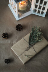 Christmas composition. Gift, fir tree branches, balls and decorations on paper background. Christmas, winter, new year concept. Flat lay, top view, copy space