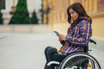 Woman with disability using a smartphone while out in the city