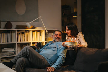 adult couple celebrating anniversary at home