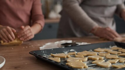 Caucasian girl baking homemade cookies with grandmother. Shot with RED helium camera in 8K  