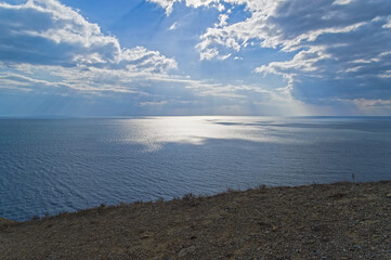 Spots of light on the sea surface.
