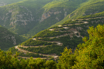 Winding road near Voidomatis River Vikos Gorge National Park, northern area of mainland Greece  - Powered by Adobe