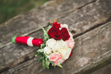 Beautiful wedding bouquet with different flowers, roses