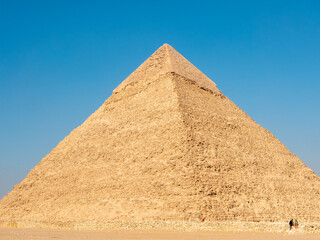 Giza, Cairo, Egypt - September 30, 2021: Great Egyptian pyramid against the blue sky. Close-up.