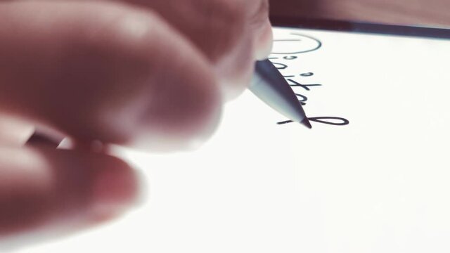 Writing Digital Banking With a Stylus on the Tablet Close Up Shot 4K