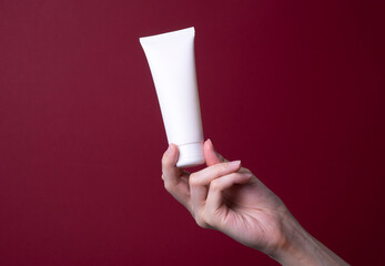 packaging of hand cream in female hands
