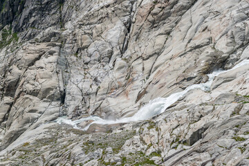 Fototapeta na wymiar Mountainscape with the source of the Rhone near Oberwald