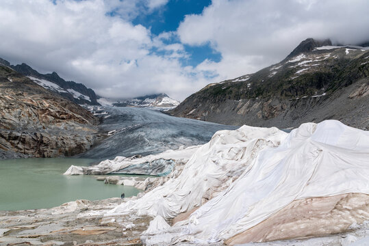 Rhone glacier partially covered with white tarpaulins near Oberwald in Valais