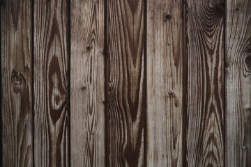 Close up shot of clapboard decoration. Brown natural wooden wall with texture. Vertical Old Wood Slats. Rustic Shabby Planking Background. Board Panel. Grungy Facade. Wallpaper, Pattern
