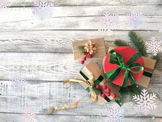 Christmas gifts on the wooden background