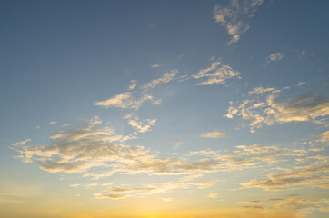 Sunset sky. Abstract nature background. Dramatic blue with orange colorful clouds in twilight time.