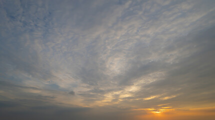 Sunset sky. Abstract nature background. Dramatic blue with orange colorful clouds in twilight time.